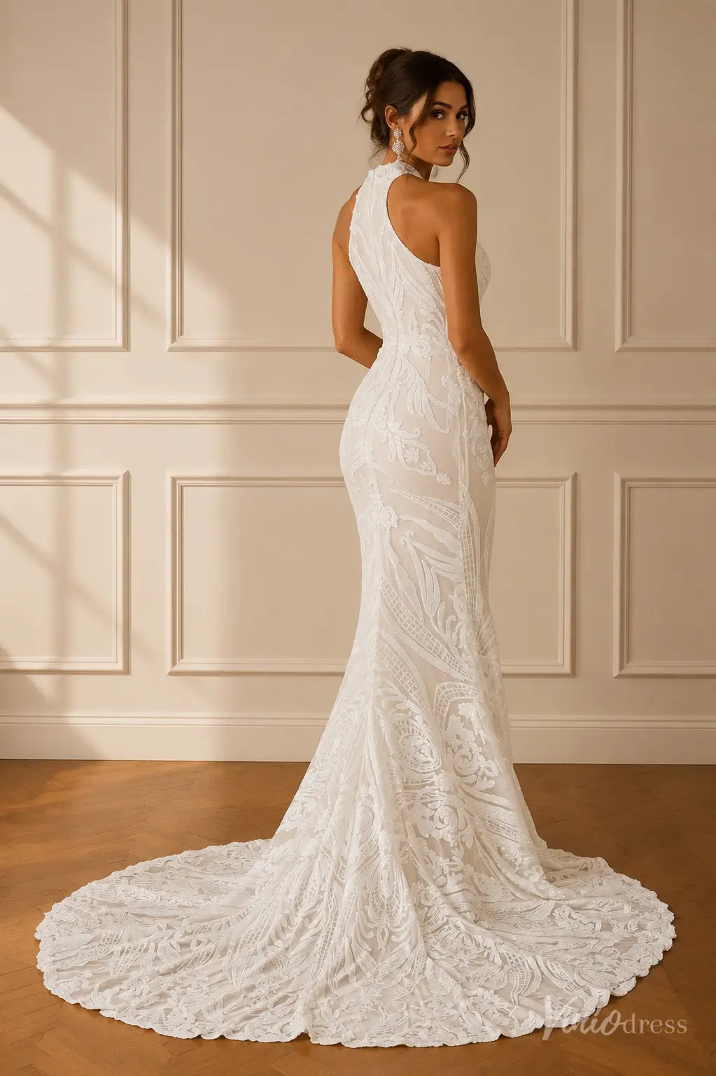White sleeveless mermaid wedding dress with intricate lace embroidery, high neckline, and a sweeping train.