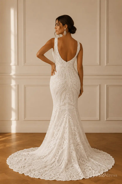 White mermaid wedding dress featuring ornate paisley lace, wide straps, a plunging low back, and a scalloped lace train.