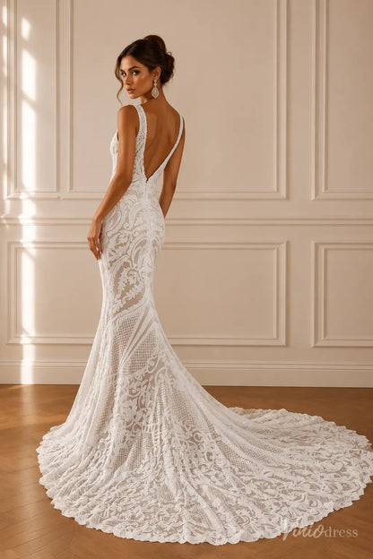White mermaid wedding dress with ornate paisley lace, V-neckline, wide straps, and a dramatic plunging low back with train.