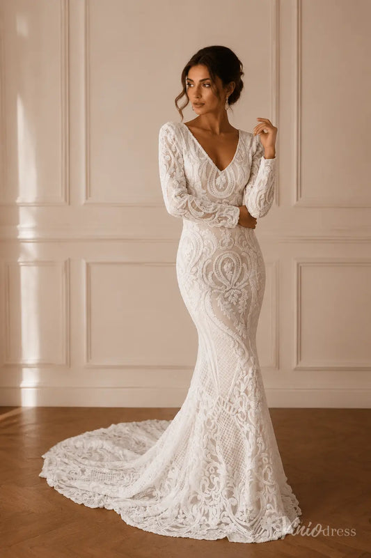 White long-sleeve mermaid wedding dress featuring intricate lace embroidery, a deep V-neckline, and a sweeping train.