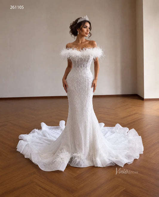 White mermaid wedding dress with feather-trimmed off-shoulder neckline, vertical pearl beading, and ruffled flared hem.