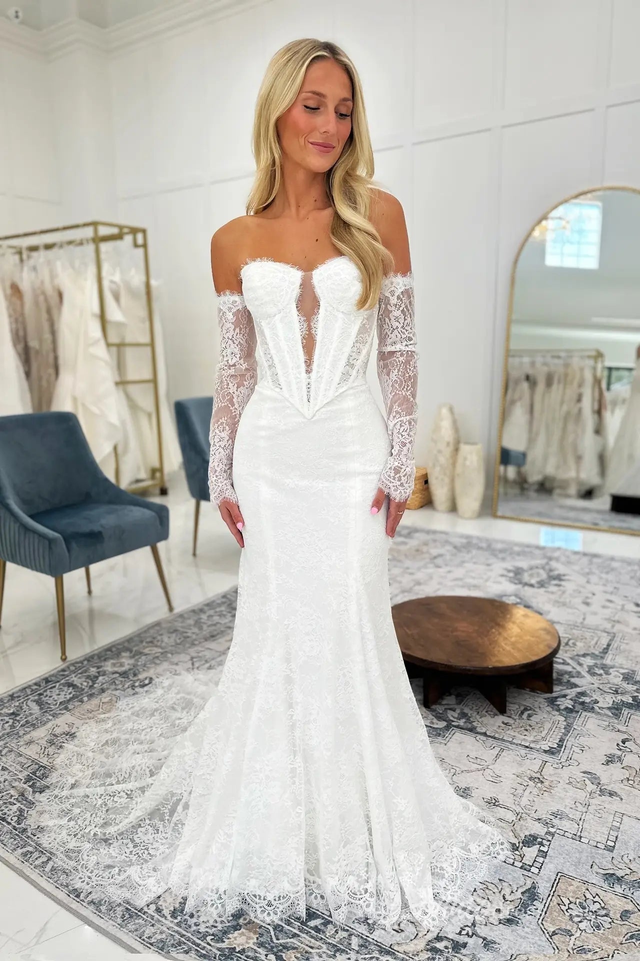 Elegant Ivory Lace Mermaid Wedding Dress with Deep Plunging Neckline, Long Lace Sleeves & Corset Bodice – ML174