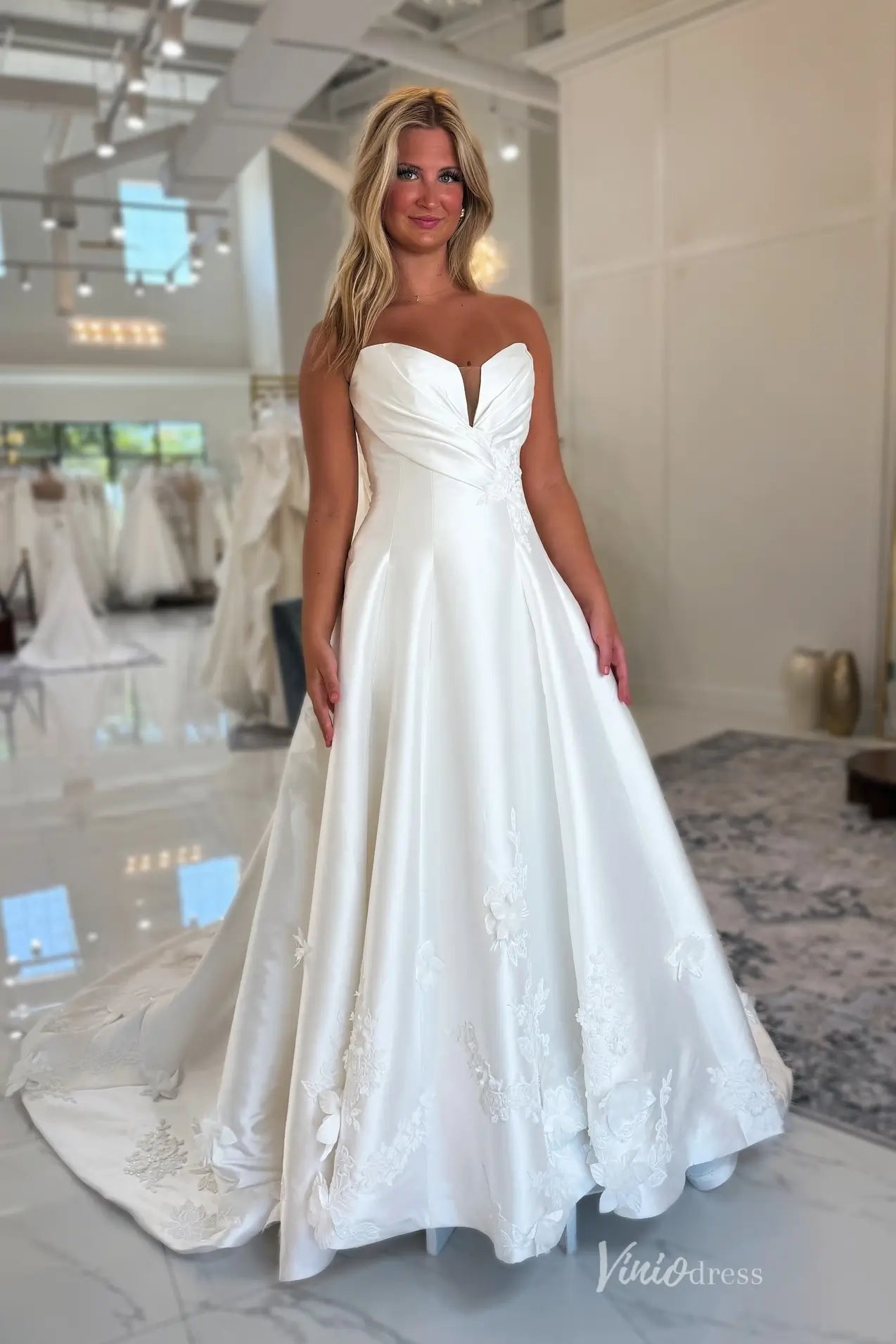 Elegant Satin A-Line Wedding Dress with Ruched Sweetheart Bodice, Floral Appliqué Hem & Chapel Train – MS135