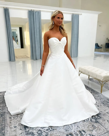 Elegant Satin Ball Gown Wedding Dress with Sweetheart Neckline, Illusion Corset Back & Button Chapel Train – MS144